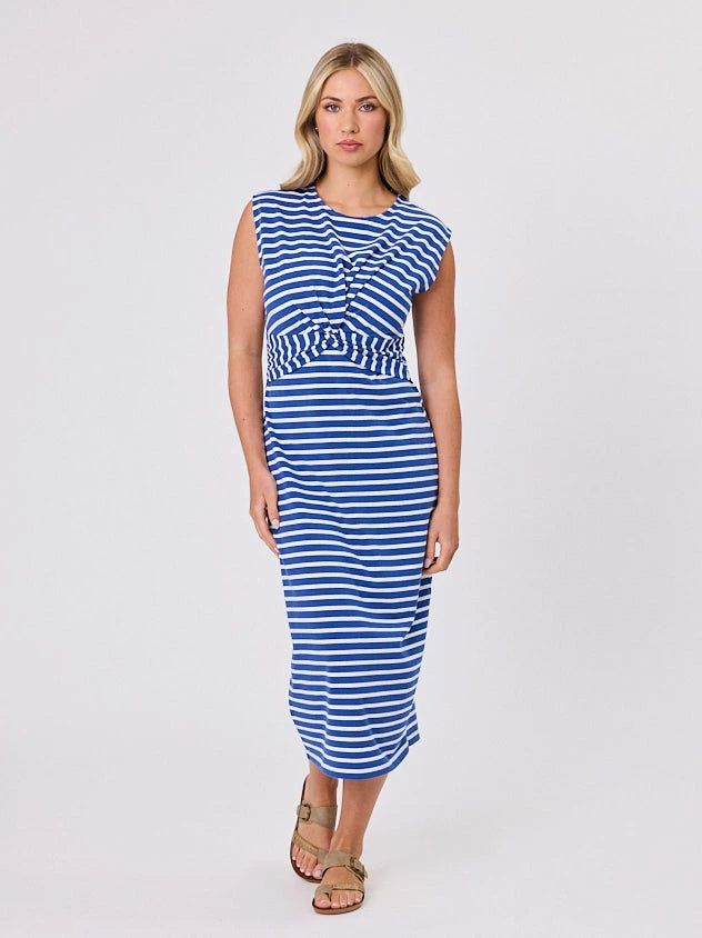 Woman wearing a coastal living inspired ocean blue striped cotton dress by Navy & Co, standing front-facing in natural light