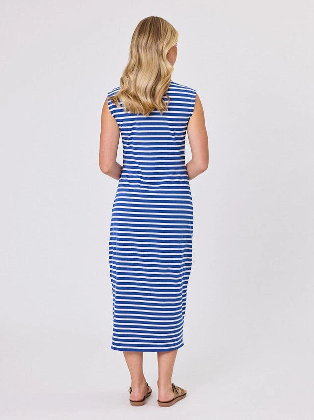 Woman wearing a coastal living inspired ocean blue striped cotton dress by Navy & Co, standing front-facing in natural light