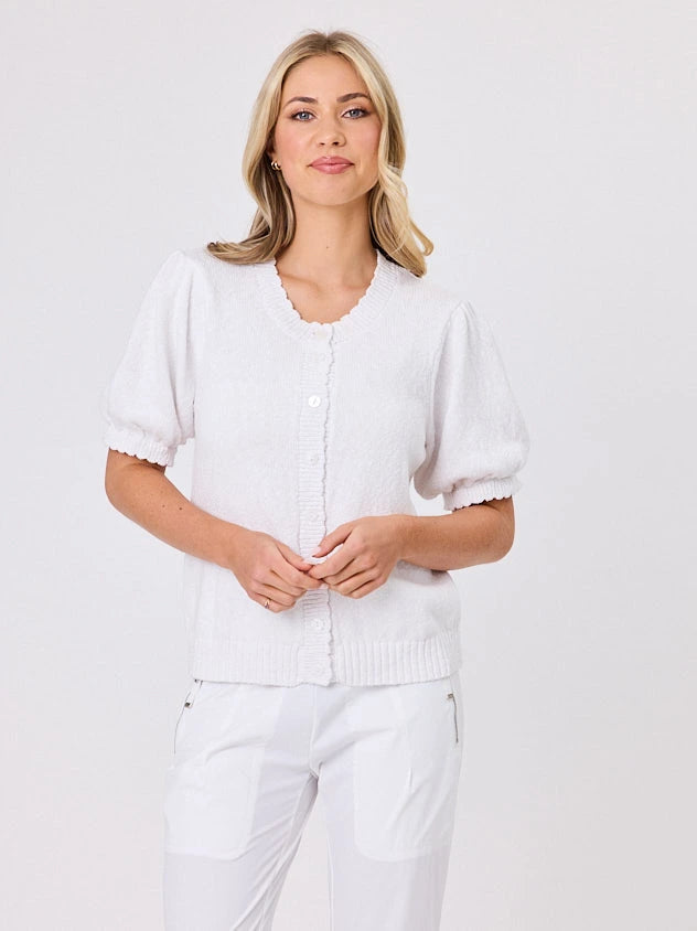 Woman wearing a white lightweight knit cotton cardi top by Navy & Co fashion brand, standing front-facing in natural light