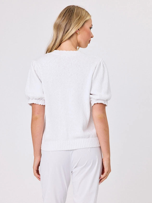 Woman wearing a white lightweight knit cotton cardi top by Navy & Co fashion brand, standing front-facing in natural light