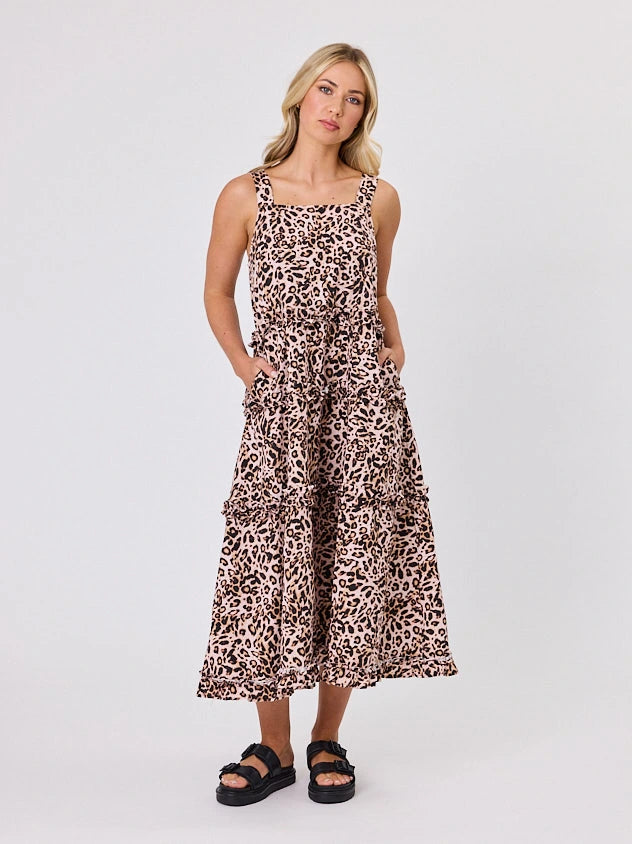Woman standing front-facing in natural light wearing Animal Print A-line Regalia dress by Navy & Co fashion brand 