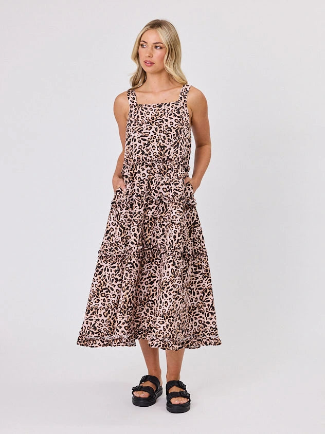 Woman standing front-facing in natural light wearing Animal Print A-line Regalia dress by Navy & Co fashion brand 