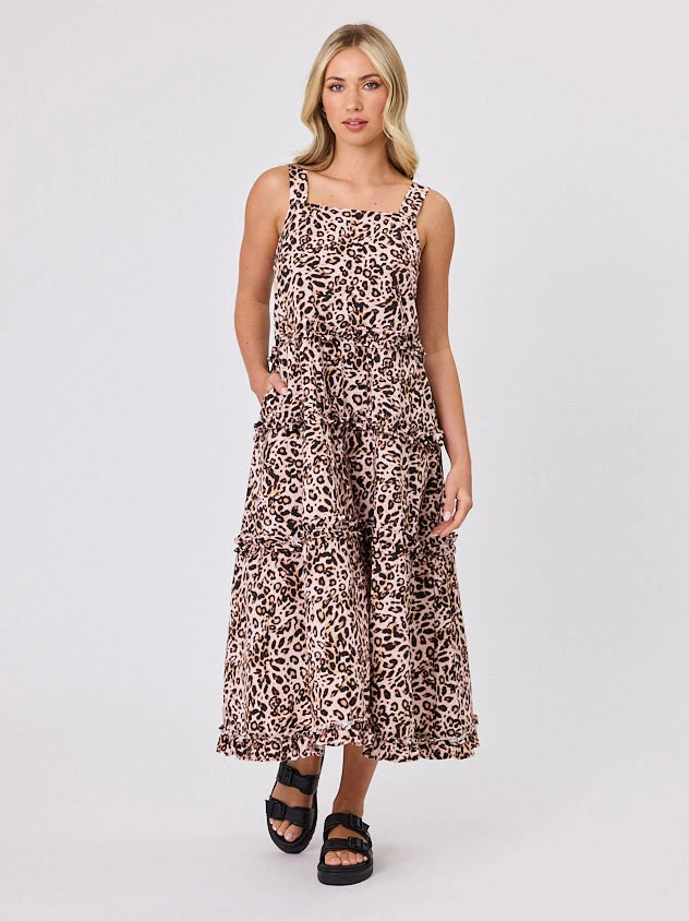 Woman standing front-facing in natural light wearing Animal Print A-line Regalia dress by Navy & Co fashion brand 