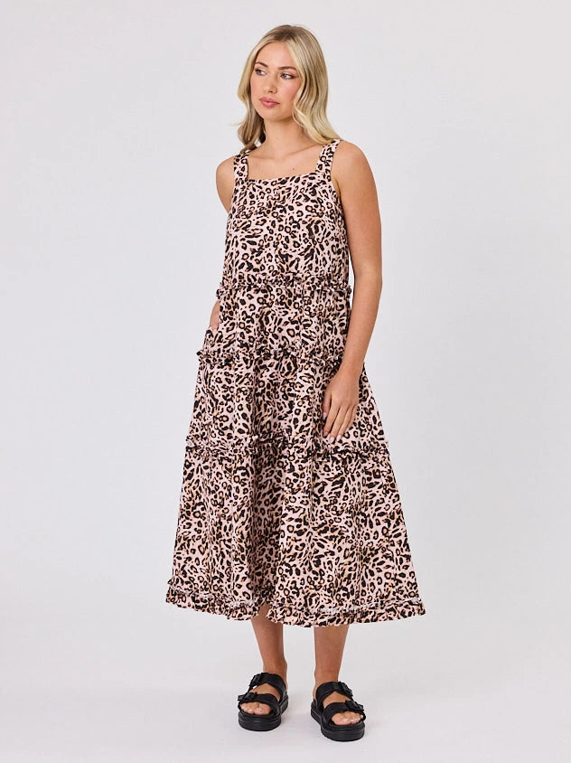 Woman standing front-facing in natural light wearing Animal Print A-line Regalia dress by Navy & Co fashion brand 