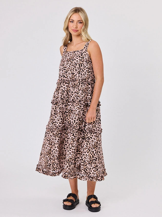 Woman standing front-facing in natural light wearing Animal Print A-line Regalia dress by Navy & Co fashion brand 