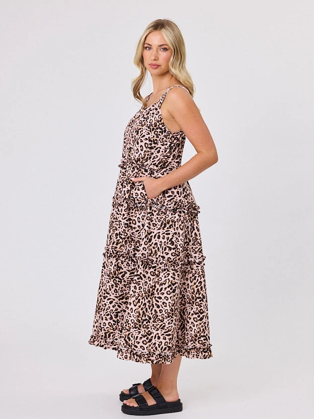 Woman standing front-facing in natural light wearing Animal Print A-line Regalia dress by Navy & Co fashion brand 