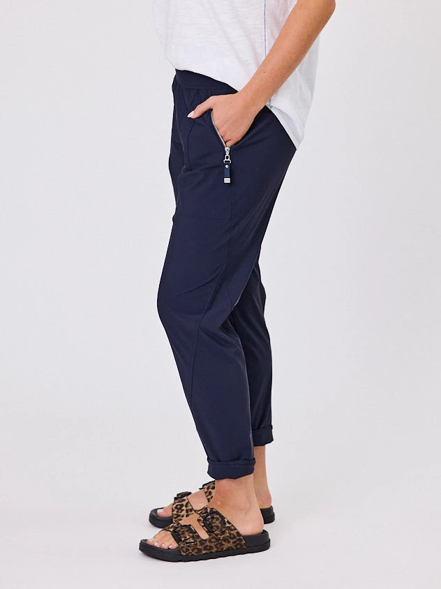 Woman standing front-on in studio light wearing navy crew pocket pants by Navy & Co nz fashion brand 