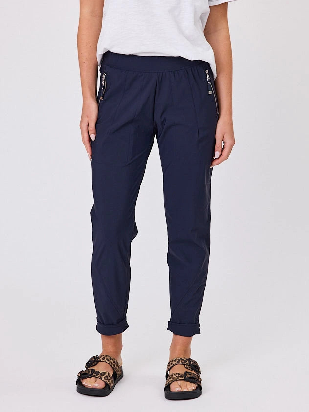 Woman standing front-on in studio light wearing navy crew pocket pants by Navy & Co nz fashion brand 