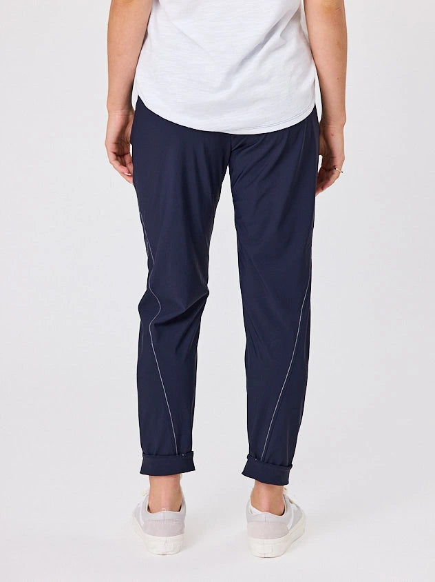 Woman standing front-on in studio light wearing navy crew pocket pants, with white stich by Navy & Co nz fashion brand 