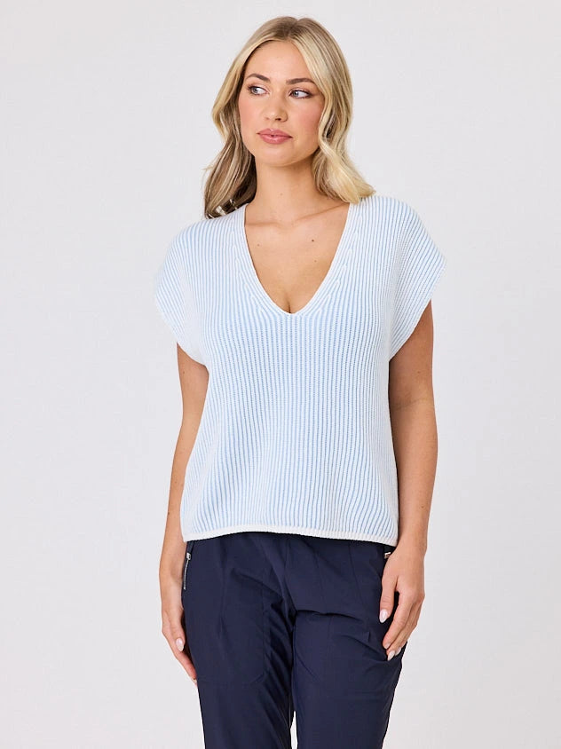 Woman wearing a light blue tint ribbed top and navy pants from Navy & Co NZ Fashion Brand on a white background