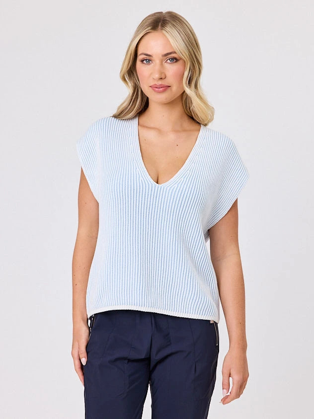 Woman standing front-on in studio light wearing white cotton ribbed top, by Navy & Co nz fashion brand 