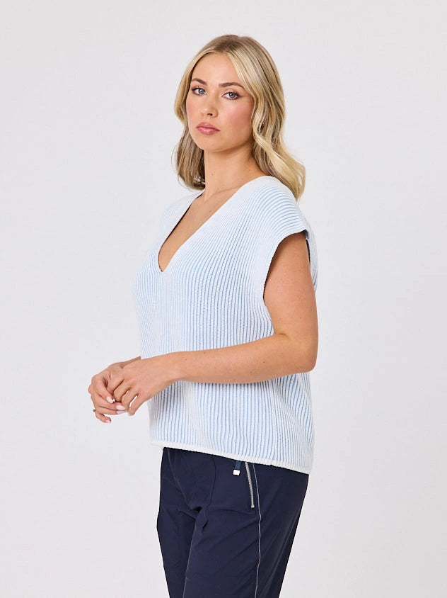 Woman standing front-on in studio light wearing white cotton ribbed top, by Navy & Co nz fashion brand 