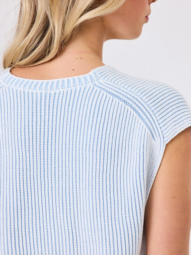 Woman standing front-on in studio light wearing white cotton ribbed top, by Navy & Co nz fashion brand 
