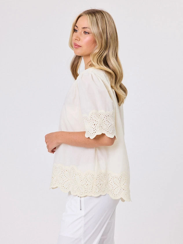 Woman standing front-on in studio light wearing lemon cotton top, by Navy & Co nz fashion brand 