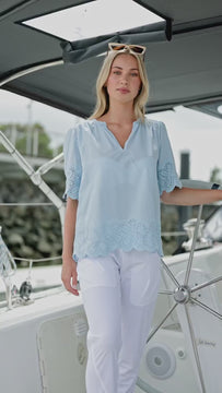 video of woman on a boat wearing Pastel Blue Cotton Guipure Top by Navy co Women's fashion nz 